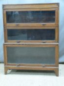 An oak Globe Wernicke style three tier glazed bookcase, W91 x D29 x H116cm
