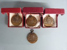 Four 1953/1954 Coronation bronze swimming medals for King Edward VII school, Sheffield, the
