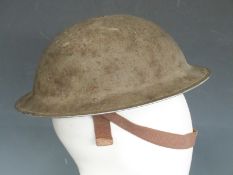 British Army WWII 'Brodie' steel helmet with liner and chinstrap
