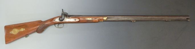 Muzzle loading percussion hammer action gun with chequered semi-pistol grip and forend, brass
