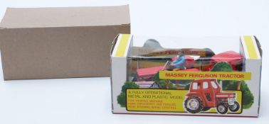 Britains diecast model Massey-Ferguson Tractor with red body, silver hubs and driver 9529, in