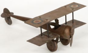 Burnett Ltd The 'Joey' tin plate aeroplane with bronze finish and RAF roundels, 35cm long