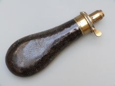 Sykes leather covered metal and brass powder flask, 19.5cm long.
