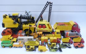 Twenty-three Tonka pressed steel toys including Mighty Tonka Crane 45cm long, forklift, dumper