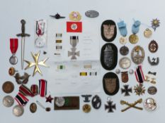 WWII German quantity of reproduction insignia, medals etc