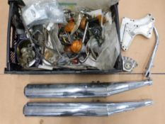 Box of Norton Commando motorcycle parts including silencers, indicators etc
