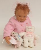 Waltraud Hanl silicone doll Anna-Lena with closed mouth, brown eyes and red hair, in pink outfit,