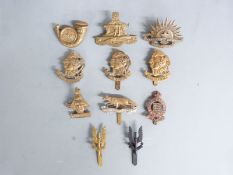 A small collection of British Army and other cap badges including Artist's Rifles and Special Air
