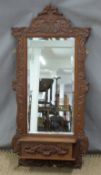 Carved oak hall mirror with bevelled glass and integral glove box. W49 x H106cm