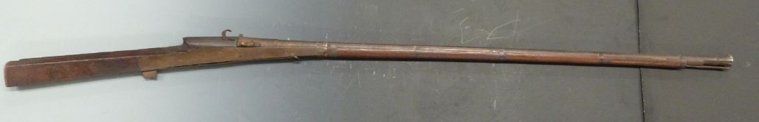 Middle Eastern matchlock gun with brass lock plates, steel bands and ram-rod, stock stamped 1652 and