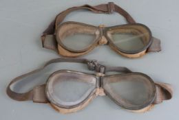 Two pairs of folding flying goggles with fur backed surround