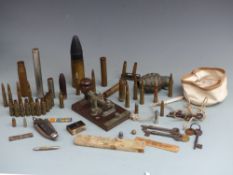 A small collection of militaria including inert ammunition, a practice hand grenade, clasp knife