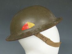 British Army WWII 'Brodie' steel helmet stamped JSS 1939, with liner and chinstamp