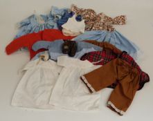 A collection of Sasha doll clothes and outfits including dresses, skirts etc.