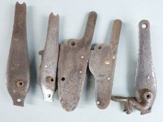 Five various gun locks including one named Hughes, all with engraved decoration, largest 12cm long.