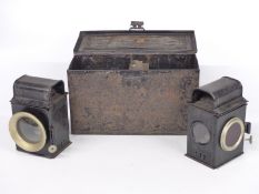 Pair of bicycle or motorbike front and rear oil lamps in metal box with extra fuel can to centre,