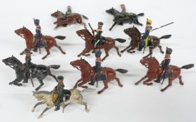 A large collection of Britains and similar lead and diecast model cavalry soldiers and horses.