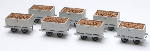 A rake of seven 32mm gauge garden railway open stone wagons