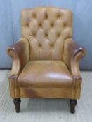 A leather Chesterfield armchair. W79 H95cm