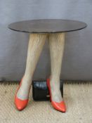 Retro / kitsch glass topped table supported by two ladies' stockinged legs in red high heels with