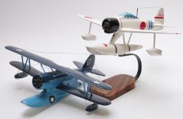 Two wooden model aeroplanes, one Naka Jima A6MZ-N on wooden base with name plaque, largest 40cm