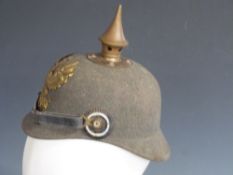 German / Prussian Army 19thc green felt pickelhaube helmet, complete with leather chin strap and