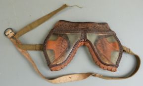 A pair of WWII American leather goggles dated 1943