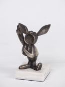Novelty car mascot or similar in the form of a rabbit playing a banjo, on base, overall height 12cm