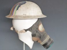 WWII steel 'Brodie' helmet 1939 with liner, strap and respirator mask, EC Co stamped to rim