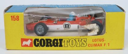 Corgi Toys diecast model Lotus Climax F/1 with two-tone orange and white body and racing number 8