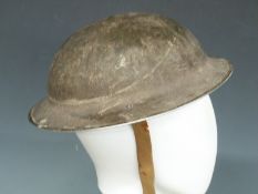 British WWII 'Brodie' steel helmet with liner and strap, stamped H542 to rim