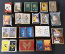 A large quantity of English playing cards with decorative backs