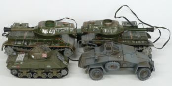 Four model tanks including two Japanese remote controlled examples, largest 23cm long