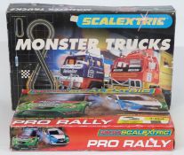 Two Scalextric model motor racing sets Micro Scalextric Pro Rally E1055 and Monster Trucks C1024,