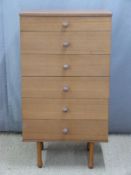 Retro Avalon chest of six straight drawers raised on shaped turned legs. W61 x D44 x H112cm