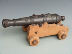 Cast iron desk or signalling cannon with ornate decoration to the graduated multi-stage barrel, on