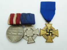 WWII German Nazi Third Reich Civil and Social Services medals together with a 25 years Faithful