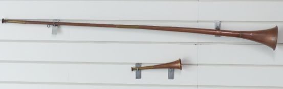 A copper and brass coaching horn and a hunting horn