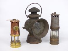 Lucas King of the Road no 742 veteran or early motor car lamp and two mining lamps, height 35cm