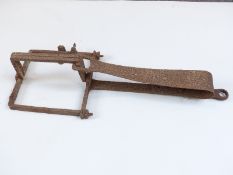 A 19thC man / bear trap of iron construction with single spring loaded mechanism, originally from