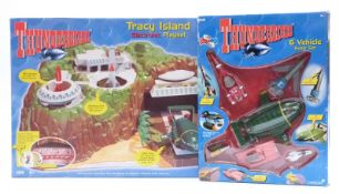 Vivid Carlton Thunderbirds Tracy Island Electronic Playset and Six Vehicle Super Set, both in