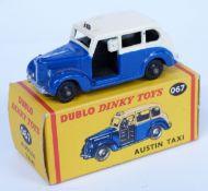 Dublo Dinky Toys diecast model Austin Taxi with blue and cream body 067, in original box.