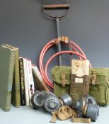 A collection of militaria to include two gas masks and six books including two volumes of Army &