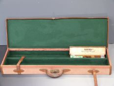 A fitted fabric covered gun case with leather trim, handles and straps, 96x29cm and a Parker Hale