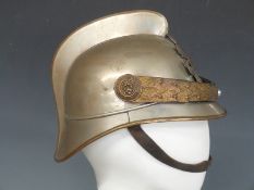 German officer's fire helmet with liner and ornate chin strap