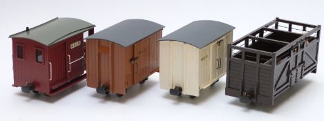 Four 32mm gauge garden railway goods vans including a guard's van