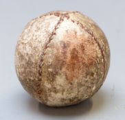 A 19thC hand stitched leather feather filled golf ball