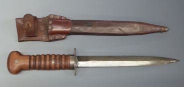 WWI Dutch fighting knife with wooden handle and 20cm double edged blade, in leather scabbard with