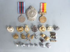 A small collection of militaria including two Pakistan medals and a Mine Clearance Service arms