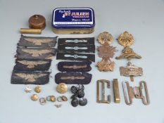 A small collection of militaria including cap badges, Gloucestershire Regiment, Canada 21, RAF